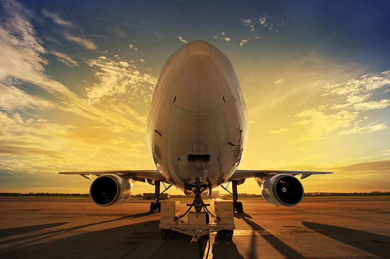 Airplane at sunset - back lit